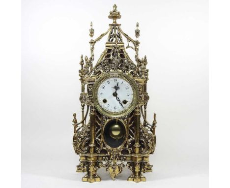 An ornate continental brass cased mantel clock, 20th century, with a twin train movement, striking on a bell, 46cm high
