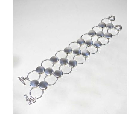 A Danish silver Circle bracelet, designed by Regitze Overgaard for Georg Jensen, model 464, stamped marks, 110g, 18cm long4cm