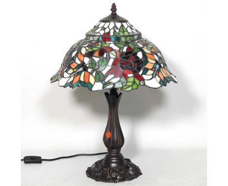 A Tiffany style table lamp, with a stained glass shade, 55cm high