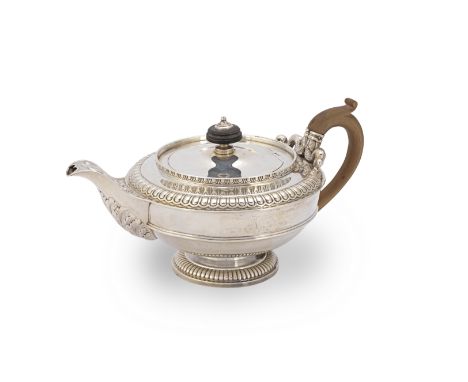 A George IV silver teapotPaul Storr, London 1810 Rounded squat form with a gadroon border, serpent handle sockets, engraved w