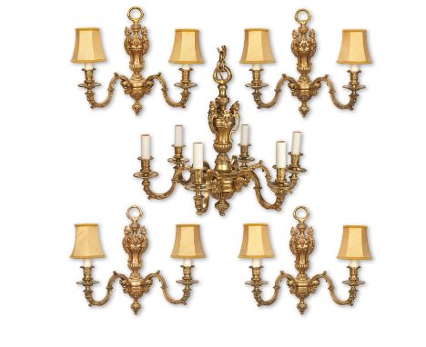 A set of four gilt metal wall lights, 20th centuryEach with two scroll arms and Classical satyr masks, with a six light chand