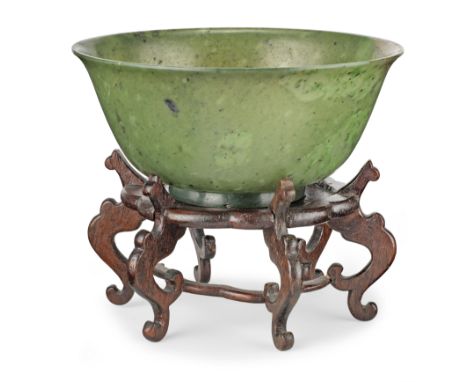 A Chinese spinach jade bowlWith slightly everted rim, raised on a shallow foot, together with a shallow dish, 13.5cm x 13.5cm