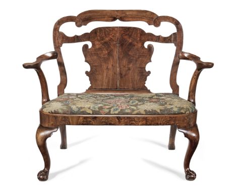 A walnut chair back sofaEarly 18th century and later The undulating top rail above a central fret carved back with 'shepherd 