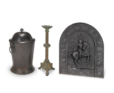 A Victorian cast metal pricket candlestick together with a cast iron fire back and a painted tole coal bucketThe coal bucket 