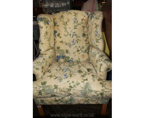 A modern Georgian style wing back fireside Armchair, scroll arms and square Beech legs, upholstered in light yellow ground fa