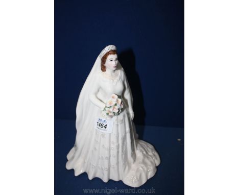 A Royal Worcester figure of Her Majesty Queen Elizabeth II, 9'' tall.
