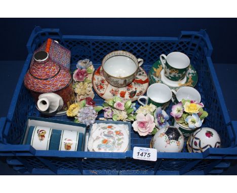 A quantity of china including coffee Cans and saucers, oriental cup and saucer, porcelain eggs, posies, etc.