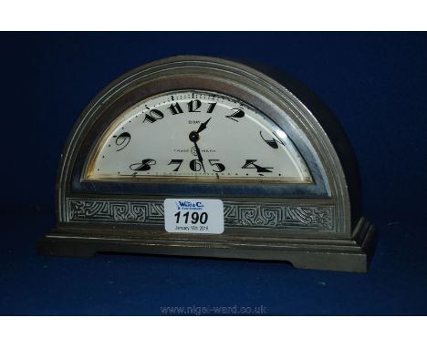A pewter Mantle Clock in art deco half moon shape