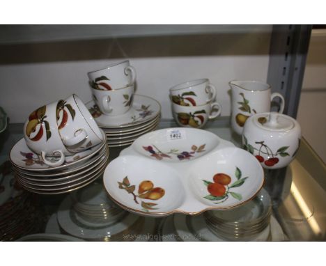 A part Royal Worcester 'Evesham' Teaset comprising six Cups and saucers, six Tea Plates, Milk Jug, Sugar Bowl and an Entree D