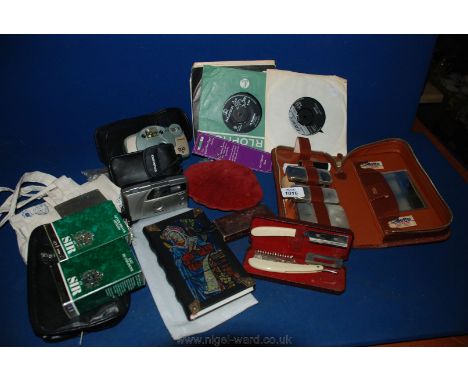 A quantity of miscellanea including Gents travel set, Polaroid camera, cased razor, jewellery boxes, 45 rpm records, etc.