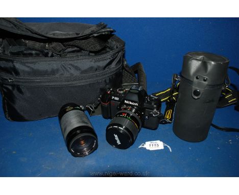A Nikon F -301 camera with a Vivitar 55 mm lens and a Vivitar 70 - 300 mm lens with instructions, all in a Sacar carry case.