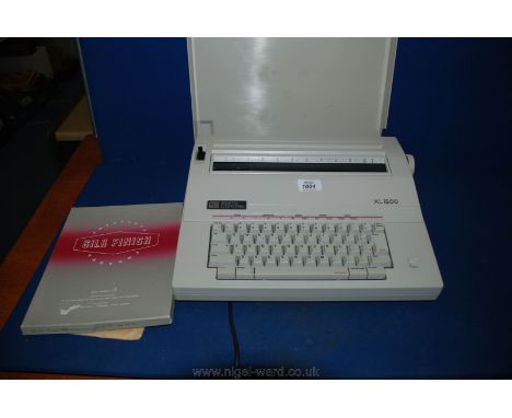 A Smith Corona XL 1500 electric Typewriter with manual and carbon papers.