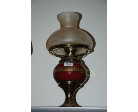 A converted Oil Lamp with pink and gold glass reservoir and etched glass shade
