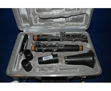 A cased Odessy Clarinet.