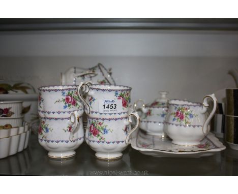 A Royal Albert 'Petit Point' part Tea Set comprising six Tea Cups and saucers, six Tea Pates, lidded Sucrier, Milk Jug, Cake 