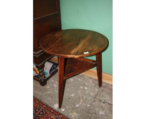 A superb mid 18th c. Elm topped Cricket Table having well figured three plank circular top on triangular Oak base with three 