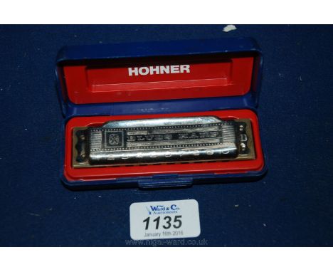 A cased ''Hohner'' Blues Harp'' D