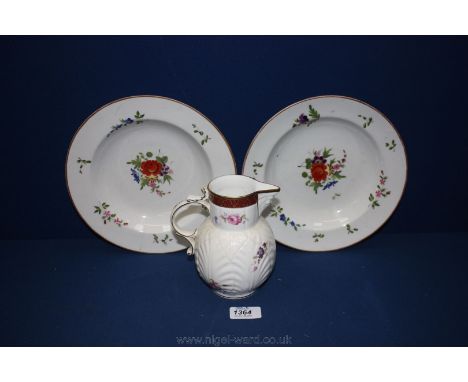 A reproduction Caughley Mask-head Jug and two early hand painted porcelain Soup Plates
