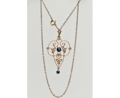 A YELLOW METAL LAVALIER PENDANT NECKLACE, openwork scroll pendant, set with a central blue paste, and split pearls, with a bl