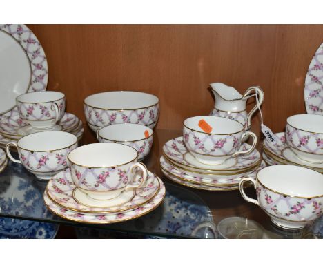 A THIRTY SIX PIECE EARLY TWENTIETH CENTURY MINTON TEA SET, pattern no S50, printed and tinted with purple ribbons and garland