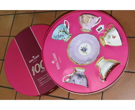 A BOXED SET OF ROYAL ALBERT CUPS AND SAUCERS, to commemorate one hundred years of English Craftsmanship, five cups and six sa