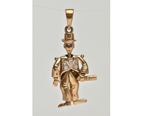 A 9CT GOLD ARTICULATED MAN PENDANT, gentlemen holding a bottle with top hat on, set with blue paste eyes and cubic zirconia j
