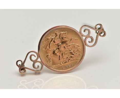 A HALF SOVEREIGN BROOCH, the brooch mounted with a half sovereign, dated 1914, to the scrolling sides, brooch stamped 9ct, ap
