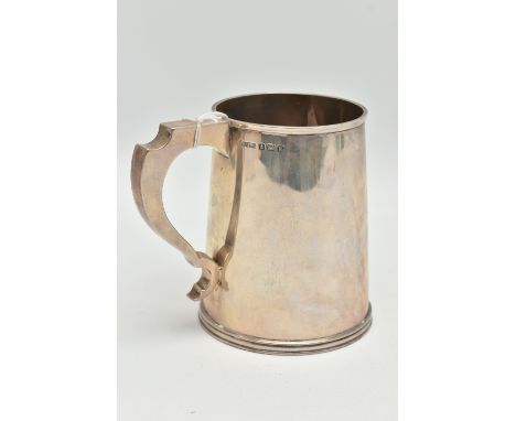 A MID 20TH CENTURY SILVER TANKARD, polished tapered form fitted with a scroll handle, approximate height 12cm, hallmarked 'Fr