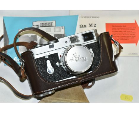 A LEICA M2 RANGEFINDER CAMERA, serial number M2-1006 225, fitted with a Leitz Summicron 50mm f2 lens, with lens cap, serial n