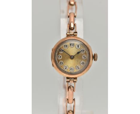 A LADYS EARLY 20TH CENTURY 9CT GOLD WRISTWATCH, manual wind, round gold dial, Arabic numerals, blue steel hands, in a polishe