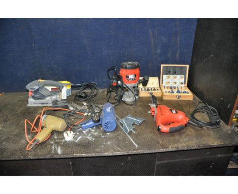 A BLACK AND DECKER KW850 1/4in ROUTER with a Wickes and a Bosch router bit sets, a Black and Decker Scorpion Reciprocating sa
