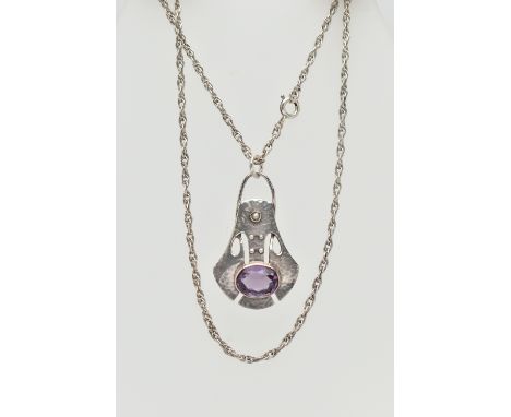 A 'MURRLE BENNET' PENDANT, a white metal pendant, with yellow metal detail, set with an oval cut amethyst, additionally set w