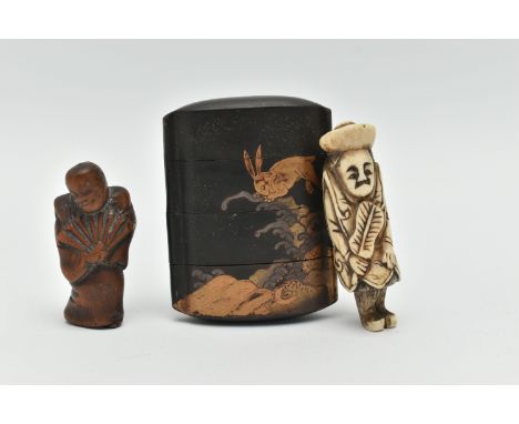 A LATE 19TH CENTURY JAPANESE BLACK LACQUERED FOUR SECTION INRO WITH HARES JUMPING ABOVE WAVES, one side with a full moon, no 
