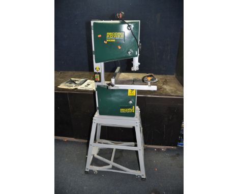 A RECORD BS250 BANDSAW ON WHEELED STAND with parallel and mitre guides, manual and spare blades, total height 154cm (PAT pass