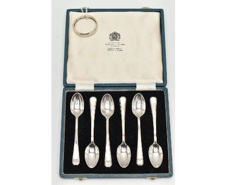A CASED SET OF SIX SILVER TEASPOONS AND A NAPKIN RING, teaspoons hallmarked Sheffield 1965, together with a worn single napki
