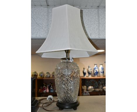 A CUT CRYSTAL TABLE LAMP, with bronzed effect base and cream shade, height to top of bulb fitting 48.5cm (1) (Condition Repor