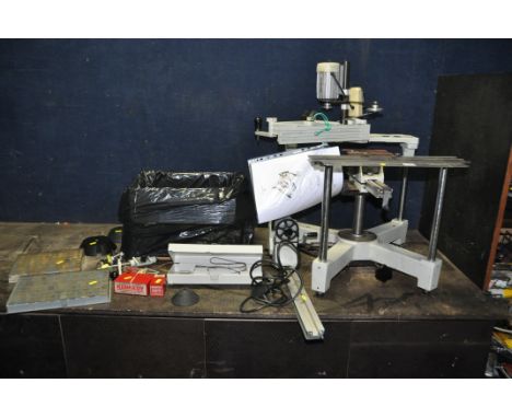 A GRAVOGRAPH IM3 MANUAL ENGRAVING MACHINE with attachments and a box of letters, stamps, and cutters (Condition report: pleas
