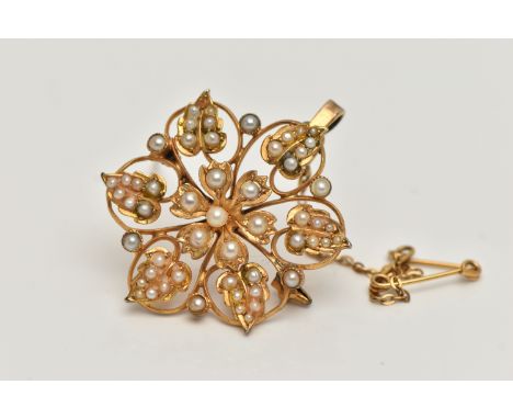 A YELLOW METAL VICTORIAN SEED PEARL BROOCH, open work flower design, set with split and seed pearls, stamped 15ct, fitted wit