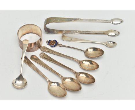 A SELECTION OF SILVER, to include a pair of bright cut Georgian sugar tongs, engraved initials to the terminal, a small pair 
