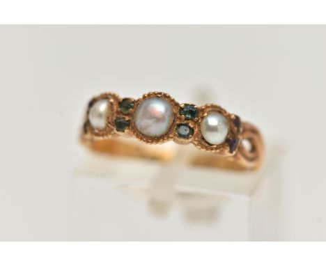 A VICTORIAN 15CT GOLD PEARL RING, designed with a row of three split pearls, each interspaced with small gemstones assessed a