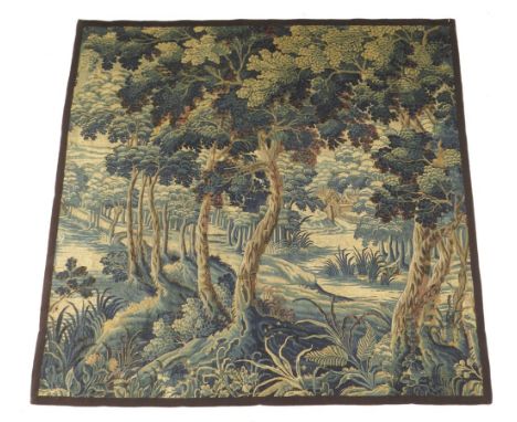 A late 17th century Flemish verdure tapestry fragment, with a manor house in a woodland setting, 198.5 x 200.5cm.