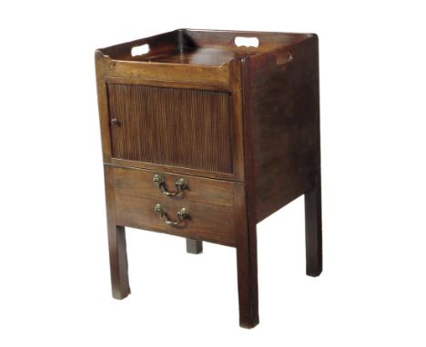 A George III mahogany tray-top bedside commode, the gallery pierced with three handgrips above a tambour shutter and a conver