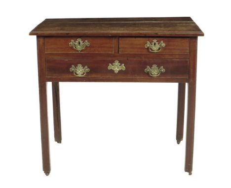 A George II fruitwood lowboy, the moulded edge top above two short and one long drawers, on moulded and chamfered legs and ro
