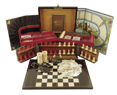 λ A Victorian coromandel and brass mounted games compendium, the lid inset with an ivory and kingwood inlaid folding chequer 