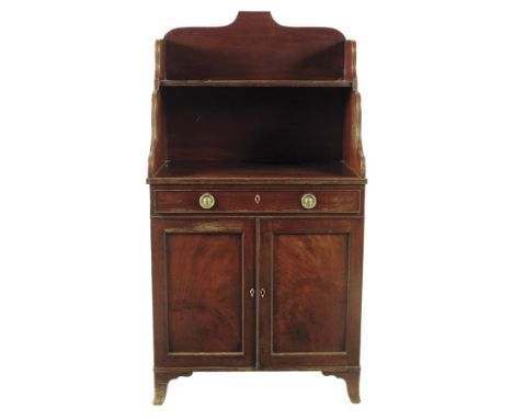 A Regency mahogany side cabinet, with a frieze drawer above a pair of panelled doors enclosing an adjustable shelf, 137cm hig