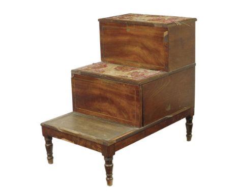 A Regency mahogany bedside step commode, inlaid with stringing and with reeded edges, with a hinged top and a pull-out chambe