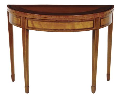 A George III satinwood and harewood demi-lune card table, inlaid with feather stringing, the hinged top crossbanded with king