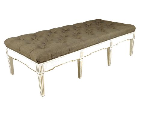 A large painted and parcel gilt stool in Adam style, the button upholstered seat on fluted tapering legs, 19th century elemen