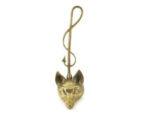 A Victorian brass fox hunting doorstop, the handle in the form of a riding crop, above a fox head mask, 40.7cm high, 12.5cm w