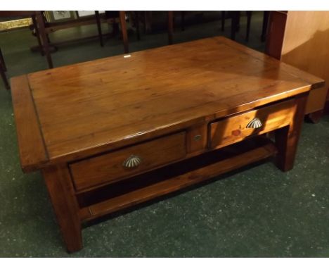 Stained pine framed rectangular plank top coffee table with two drawers, brass scalloped handles, open shelf, on heavy square